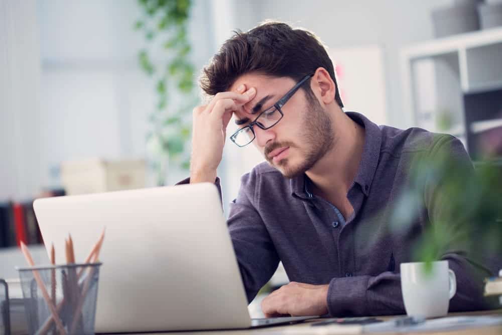 man experiencing headache