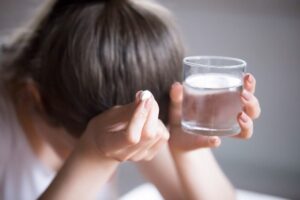 woman about to take pill