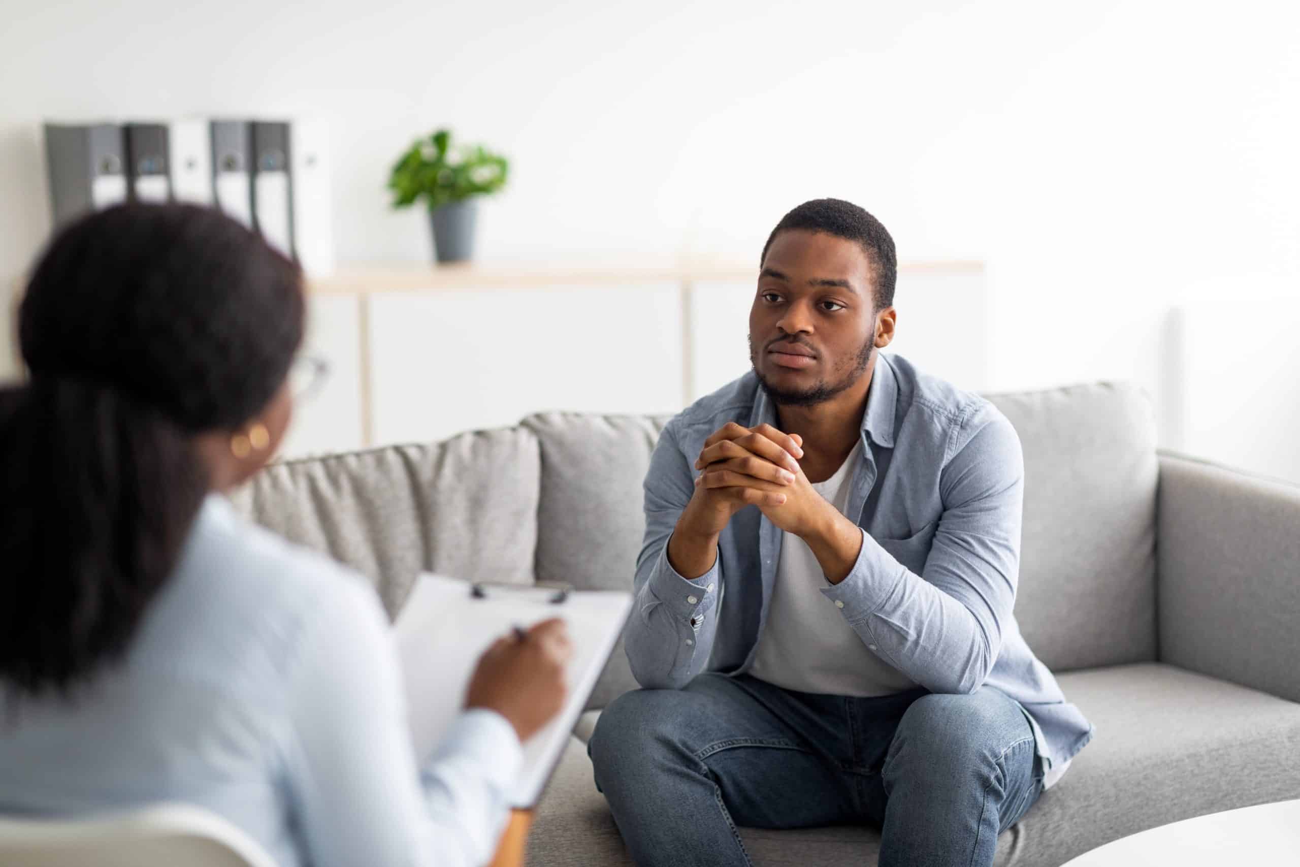 man and his therapist in mental health therapy session during rehab in south Florida