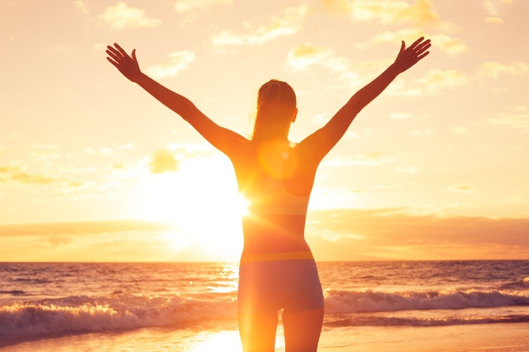 woman raising hands